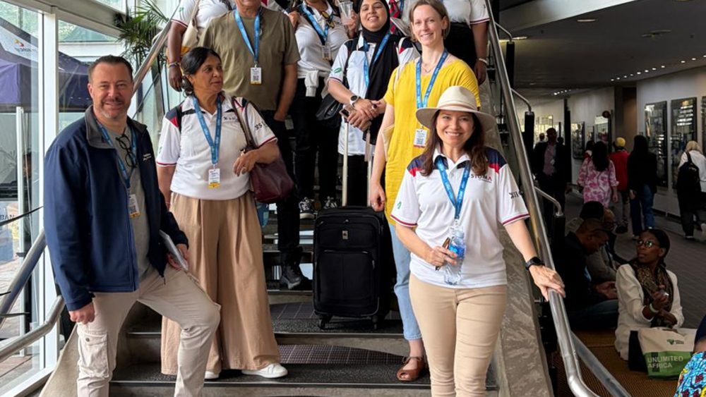 Sigma team and tourism delegates at a travel industry event